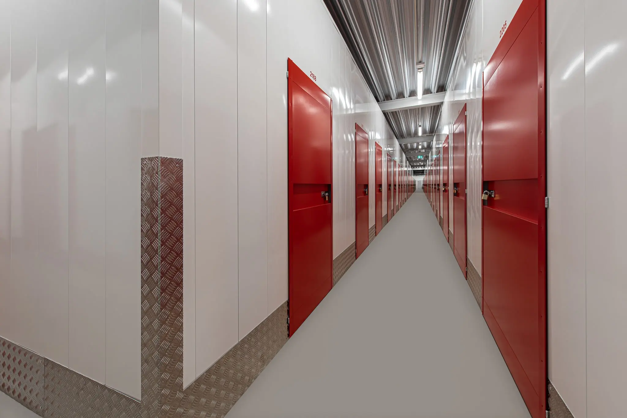 Secure storage facility with metal roller shutter doors.