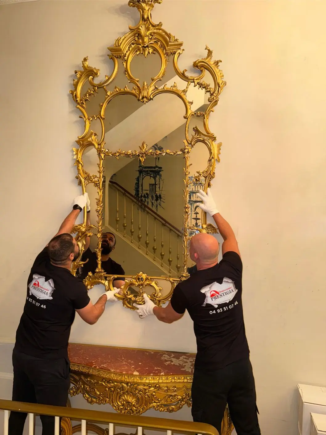Installation of an antique gilded mirror